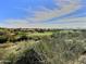 Scenic view of a lush green golf course with blue skies and fluffy white clouds in the background at 41802 N Bridlewood Way, Anthem, AZ 85086