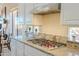 Granite countertop and stainless hood feature this bright kitchen, ideal for cooking enthusiasts at 41802 N Bridlewood Way, Anthem, AZ 85086