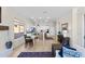 Bright living room and kitchen area with tile floors and plenty of natural light at 41802 N Bridlewood Way, Anthem, AZ 85086