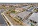 An aerial view displays the layout of the house with the gravel backyard, manicured lawn, and neighborhood setting at 5428 N 188Th Ln, Litchfield Park, AZ 85340