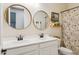 Bathroom featuring a double vanity and stylish decor at 5428 N 188Th Ln, Litchfield Park, AZ 85340