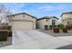 Well-maintained home featuring a two-car garage, manicured landscaping, and a clean, modern aesthetic at 5428 N 188Th Ln, Litchfield Park, AZ 85340