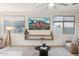 Bright living room featuring neutral tones, recessed lighting, and scenic views through large windows at 5428 N 188Th Ln, Litchfield Park, AZ 85340