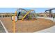 Modern community playground with climbing structure, and slide on a rubber mulch surface at 5428 N 188Th Ln, Litchfield Park, AZ 85340