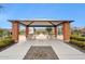 Community playground featuring picnic tables and play equipment under a shaded structure at 5428 N 188Th Ln, Litchfield Park, AZ 85340