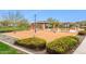 Community playground with climbing structure, covered picnic area, benches, and rubber mulch safety surface at 5428 N 188Th Ln, Litchfield Park, AZ 85340