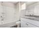 A bathroom with granite countertops, and a shower-tub combination at 5462 W Fulton St, Phoenix, AZ 85043