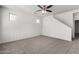 Bedroom with neutral carpet, fan and stairway at 5462 W Fulton St, Phoenix, AZ 85043