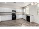 Charming kitchen featuring white cabinets and dark appliances at 5462 W Fulton St, Phoenix, AZ 85043