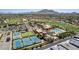 An aerial view showcases community amenities: tennis courts, pool, and recreational facilities at 6271 S Twilight Ct, Gilbert, AZ 85298