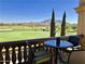 Enjoyable balcony with golf course view and distant mountain views with table and chairs at 6271 S Twilight Ct, Gilbert, AZ 85298