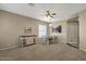 Open-concept dining room with a buffet, white chairs and table, flowing into adjacent living spaces at 6271 S Twilight Ct, Gilbert, AZ 85298