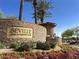 Seville Golf & Country Club stone signage with vibrant flower beds and manicured landscaping at 6271 S Twilight Ct, Gilbert, AZ 85298