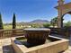 Outdoor fountain with golf course views and a backdrop of distant mountains at 6271 S Twilight Ct, Gilbert, AZ 85298