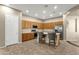 Well-lit kitchen includes a convenient island with seating and plentiful cabinet storage at 6271 S Twilight Ct, Gilbert, AZ 85298