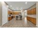 Expansive kitchen featuring a central island with barstools and extensive cabinetry at 6271 S Twilight Ct, Gilbert, AZ 85298