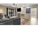 Cozy living room with a modern fireplace, built-in shelving, and sliding door access to the outdoors at 6271 S Twilight Ct, Gilbert, AZ 85298