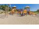 Community playground with slides, climbing structures, and a sand base at 6271 S Twilight Ct, Gilbert, AZ 85298