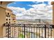 Balcony view highlighting the city skyline, nearby building, and lush green spaces at 7175 E Camelback Rd # 1106, Scottsdale, AZ 85251