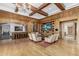 This luxurious living room features wood floors, a media center, a full bar, and gorgeous wood accents at 7175 E Camelback Rd # 1106, Scottsdale, AZ 85251