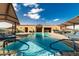 Rooftop pool offers sun loungers, blue skies, and a built-in bar area at 7175 E Camelback Rd # 1106, Scottsdale, AZ 85251