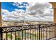 A stunning balcony view showcasing a beautiful skyline with surrounding buildings and greenery at 7175 E Camelback Rd # 1106, Scottsdale, AZ 85251