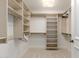 Large walk-in closet with white shelving and ample storage space at 7175 E Camelback Rd # 1106, Scottsdale, AZ 85251