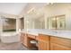 Bright bathroom featuring a large vanity, dual sinks and separate tub at 7810 W Wescott Dr, Glendale, AZ 85308