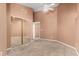 Bedroom with neutral carpet and a large mirrored closet at 7810 W Wescott Dr, Glendale, AZ 85308