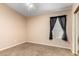 Neutral bedroom with a window and carpet at 7810 W Wescott Dr, Glendale, AZ 85308