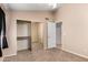 Neutral carpeted bedroom featuring mirrored closet doors, neutral walls, and a ceiling fan at 7810 W Wescott Dr, Glendale, AZ 85308