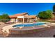 Inviting backyard pool is fenced and offers a diving board and lots of space for outdoor enjoyment at 7810 W Wescott Dr, Glendale, AZ 85308