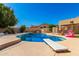 Backyard pool features a diving board and is adjacent to a covered patio for relaxing poolside at 7810 W Wescott Dr, Glendale, AZ 85308