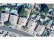 An aerial view of a well-maintained property featuring a lush backyard and neighboring pools at 9174 W Marconi Ave, Peoria, AZ 85382