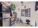 Multipurpose storage room with ample shelving, a mini-fridge, and a window for natural light at 9501 E Broadway Rd # 241, Mesa, AZ 85208