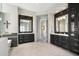 Elegant bathroom with dual vanities, dark wood cabinets, and decorative mirrors at 9776 E Granite Peak Trl, Scottsdale, AZ 85262