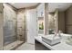 Bathroom featuring a modern vanity with glass shower and tile accents at 9776 E Granite Peak Trl, Scottsdale, AZ 85262