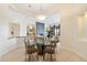 Elegant dining area featuring a glass table and views of the living room at 9776 E Granite Peak Trl, Scottsdale, AZ 85262