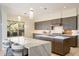 Modern kitchen with sleek cabinets, marble countertops, and pendant lighting at 9776 E Granite Peak Trl, Scottsdale, AZ 85262