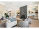 Bright living room featuring a fireplace, built-in shelves, and stylish furniture at 9776 E Granite Peak Trl, Scottsdale, AZ 85262