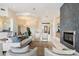 Bright living room featuring a fireplace, built-in shelves, and stylish furniture at 9776 E Granite Peak Trl, Scottsdale, AZ 85262