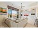 Inviting living room with floor-to-ceiling sliding glass door to outdoor patio at 9776 E Granite Peak Trl, Scottsdale, AZ 85262