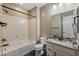 Bathroom featuring a shower-tub combo, granite counters, and tiled floors at 10617 E Durant Dr, Mesa, AZ 85212