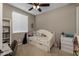 Bedroom with carpeted floors, neutral paint, window with blinds, and a ceiling fan at 10617 E Durant Dr, Mesa, AZ 85212