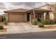 Charming single-story home with a well-manicured front yard, covered porch and a two-car garage at 10617 E Durant Dr, Mesa, AZ 85212