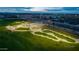 Aerial view of the community skate park featuring skate ramps, landscaping and well manicured lawn at 10617 E Durant Dr, Mesa, AZ 85212