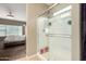 Bright bathroom featuring a clear glass shower, neutral tones, and tiled floors at 10816 W Nosean Rd, Peoria, AZ 85383