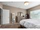 Inviting bedroom with a comfortable bed, dresser, and natural light, creating a welcoming and relaxing space at 10816 W Nosean Rd, Peoria, AZ 85383