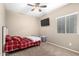 Neutral bedroom featuring carpet flooring, a ceiling fan, and a small bed at 10816 W Nosean Rd, Peoria, AZ 85383