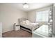 Bright bedroom featuring carpet flooring and a single bed with side tables at 10816 W Nosean Rd, Peoria, AZ 85383